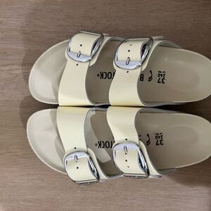 Birkenstock Cream Sandals with Silver Buckles